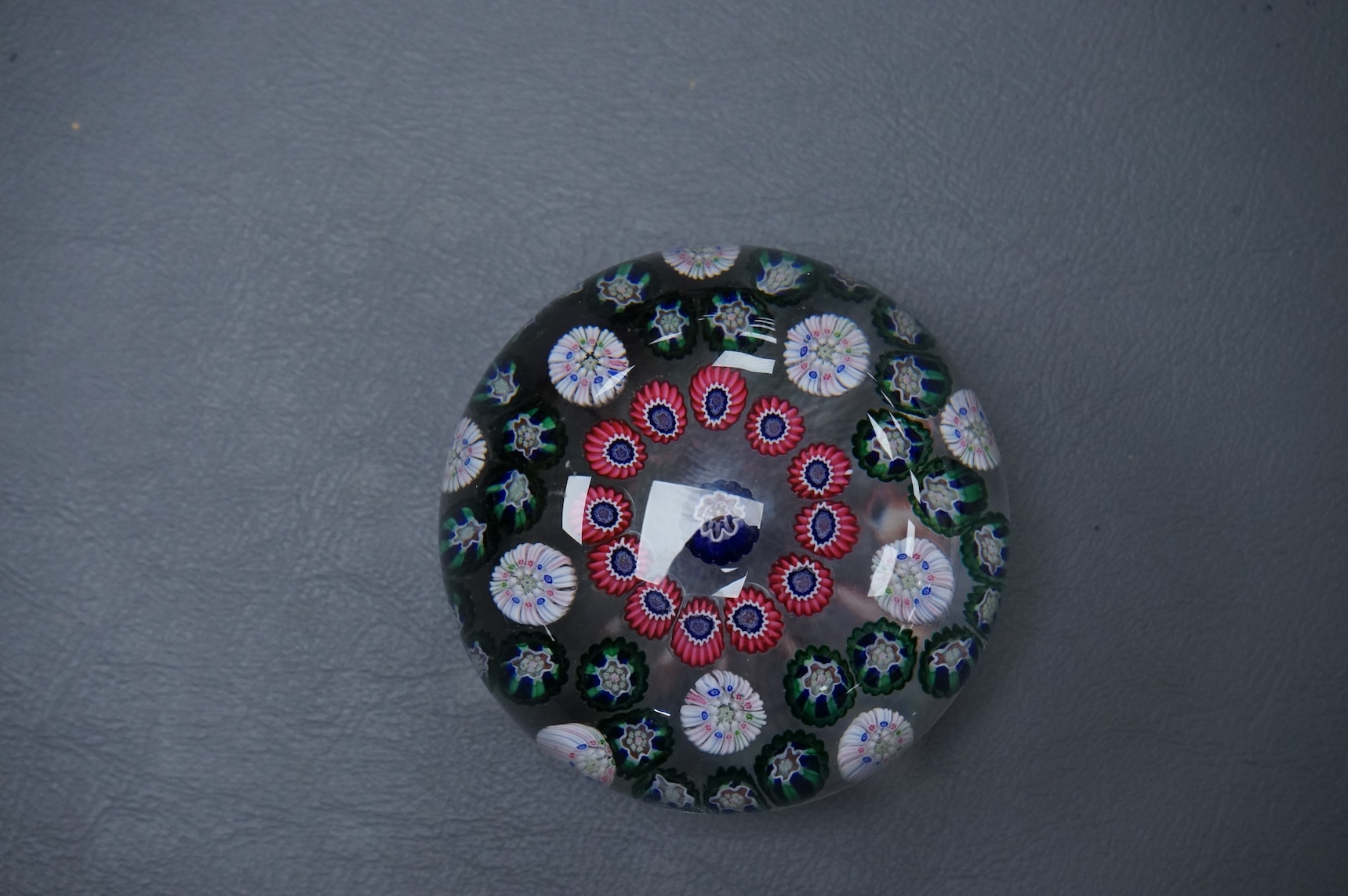 A Clichy glass garland paperweight, 7cm diameter.